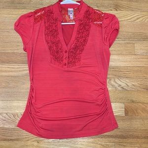 Orange ruffled blouse